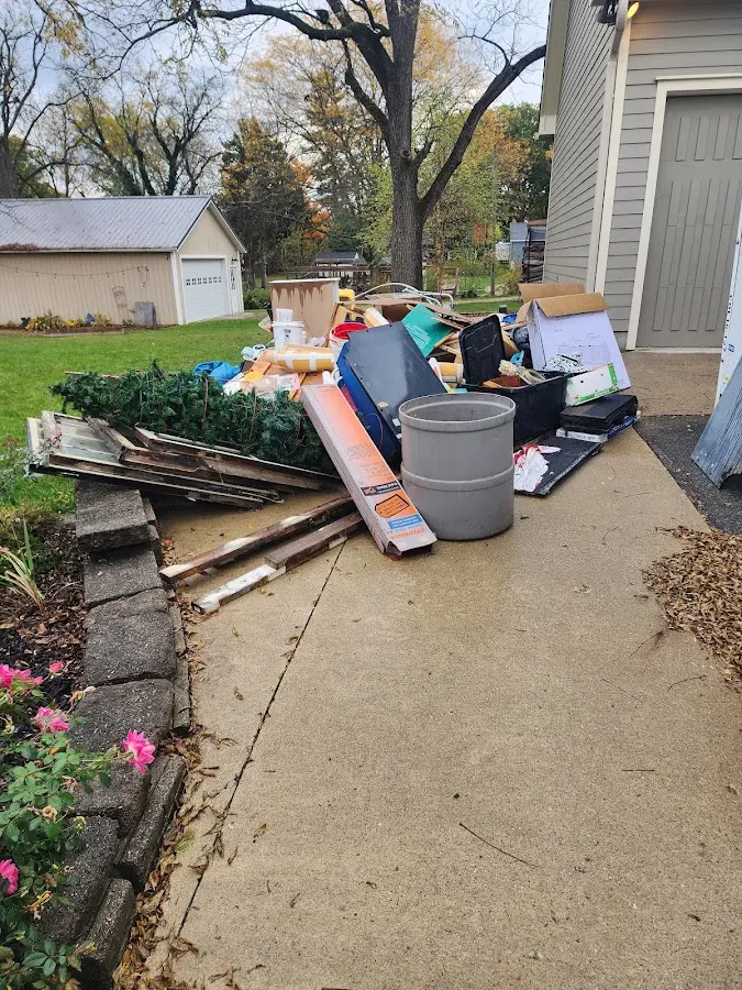 Dumpster being loaded with debris for 3 Yard Dumpster Rental in Naugatuck